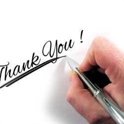 A donation from ZEPFEST! Thank You handwriting with a hand holding a pen